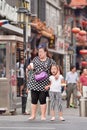 Overweight woman with child, Beijing, China